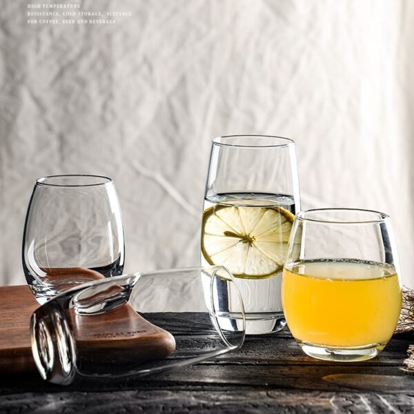 Minimalist egg-shaped clear glass tumbler, multi-purpose water beer whiskey drinking cup