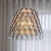 KJ056-1creative-dining-room-hanging-lamp Close-up of gray feather pendant light for dining room and restaurant interior decoration