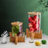 Bamboo base glass juice dispenser with bamboo lid and 304 stainless steel faucet for hotel buffet beverage service