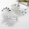 Neoclassical Roman column cutlery with ribbed handles and gold-tone accents